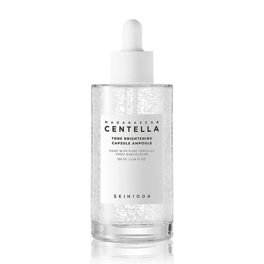 SKIN1004 Madagascar Centella Tone Brightening Capsule Ampoule 100ml in clear bottle with dropper for soothing skin care.
